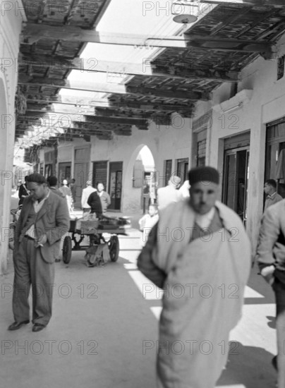 Street with shades above narrow alleyway street in Medina old town area, Tripoli, Libya, North Africa 1956