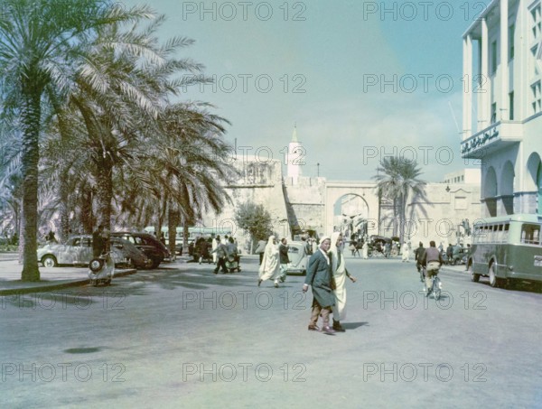 Street scene with view to Bab al-Khendig archway city gate, Tripoli, Libya, North Africa 1956
