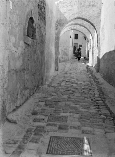 Archways in narrow alleyway street in Medina old town area, Tripoli, Libya, North Africa 1956
