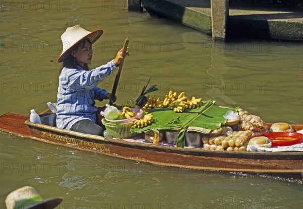 Merchant in her boat at Damnoen Saduak Floating Market, Thailand, December 2002, vintage, retro, old, historic