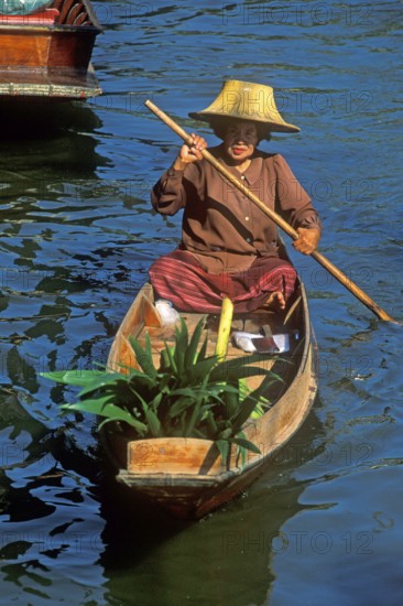 Merchant in her boat at Damnoen Saduak Floating Market, Thailand, December 2002, vintage, retro, old, historic