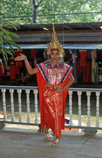 Young person wearing Thai drama clothes at Damnoen Saduak Floating Market, Thailand, December 2002, vintage, retro, old, historic
