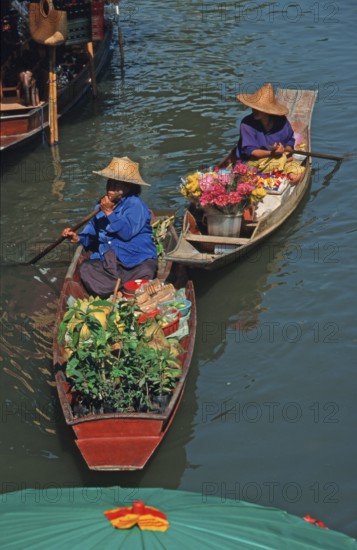 Merchants in their boats at Damnoen Saduak Floating Market, Thailand, December 2002, vintage, retro, old, historic