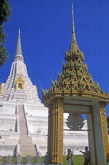 People, chedi, archway, white and gold temple Wat Phukao Thong, Ayutthaya, Thailand, December 2002, vintage, retro, old, historic