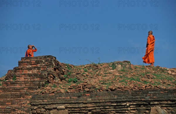 Monk takes photo of monk at Wat Phra Si Sanphet, Ayutthaya, Thailand, December 2002, vintage, retro, old, historic