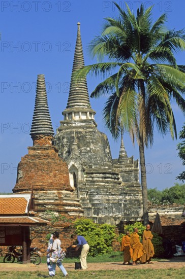 Monks, chedis, palm tree at Wat Phra Si Sanphet, Ayutthaya, Thailand, December 2002, vintage, retro, old, historic