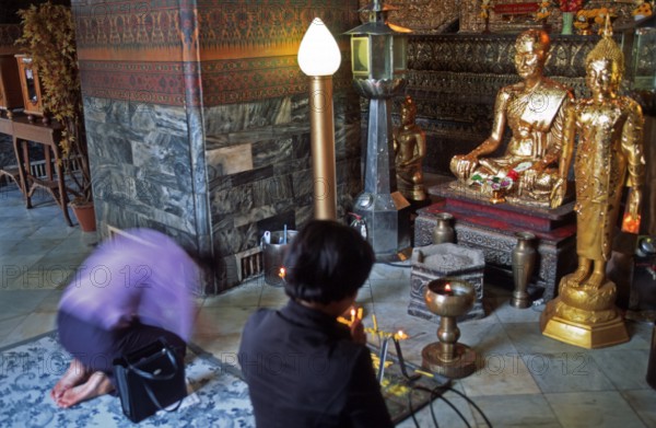 Believers praying, Wat Pho, Bangkok, Thailand, December 2002, vintage, retro, old, historic