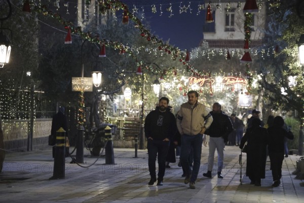 In Damascus, Syria, on December 25, 2025, festive scenes filled the streets and churches of the Bab Touma district, where thousands of people gathered to celebrate Christmas Eve amid holiday decorations and lights, Damascus, Damascus, Syria
