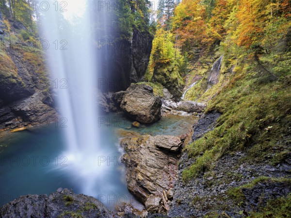 Waterfall mountain list in autumn-colored surroundings, Linthal, Klausenpass, Canton of Glarus, Switzerland