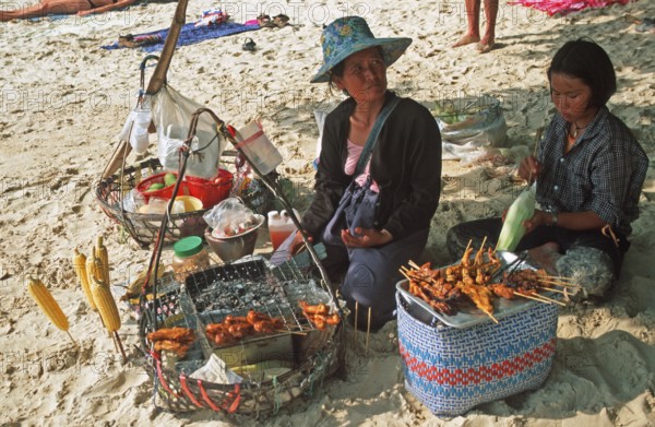 Woman and daughter with food stash on Pranang Cave beach, two years in front of the tsunami, Krabi, Thailand, December 2002, vintage, retro, old, historic