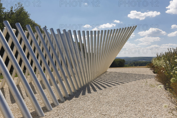Art in public space, sculpture made of aluminum profile pipes by artist Martin Burchard, life's horizon path near Mundingen, light and shadow, gravel, clouds, blue sky, walk-in art, paths of reflection and refreshment on the Ehinger Alb, Baden-Württemberg, Germany