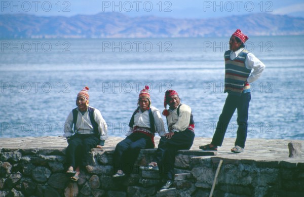 Men wearing traditional clothing on Isla Taquile in Lake Titicaca, Andean Highlands, Peru, South America, September 1997, vintage, retro, old, historic