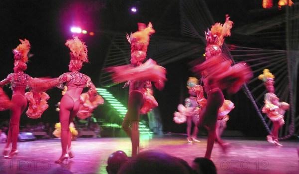 Revue dancers in opulent colorful costume and with feather headdress at Club Tropicana, Havana, Havana, Cuba