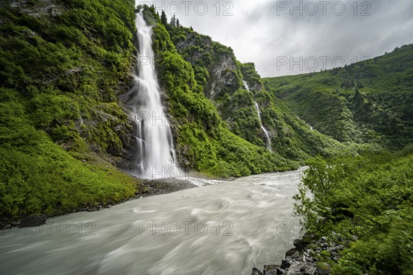 Horsetail Falls waterfall on the Lowe River in a green gorge, long exposure, Keystone Canyon, Richardson Highway, Alaska, USA