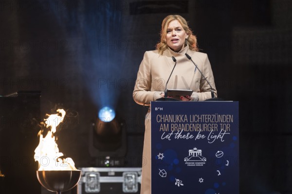Julia Klöckner (President of the German Bundestag) speaks at the lighting of lights to mark 20 years of Hanukkah in front of the Brandenburg Tor, Berlin, 17 December 2025