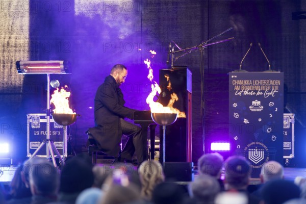Igor Levit (pianist) plays the piano at the lighting of the 20th anniversary Hanukkah in front of the Brandenburg Tor, Berlin, 17.12.2025