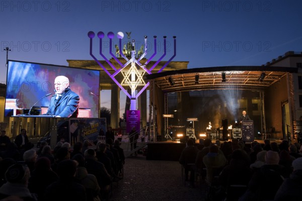 Kai Wegner (Governing Mayor of Berlin) speaks at the lighting of lights to mark 20 years of Hanukkah in front of the Brandenburg Gate, Berlin, 17 December 2025
