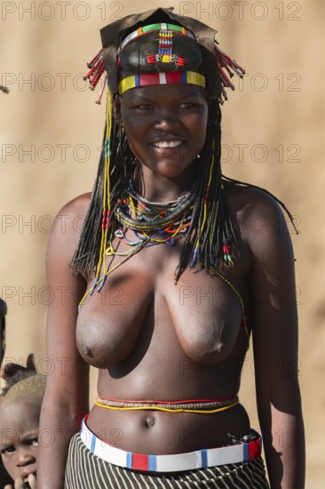Portrait, brightly decorated woman of the Hakaona tribe, also Havakona or Hakawona, near Opuwo, Kunene, Namibia