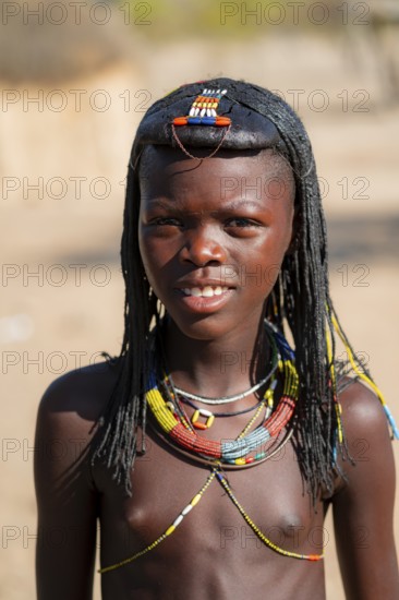 Portrait, brightly decorated girl of the Hakaona tribe, also Havakona or Hakawona, near Opuwo, Kunene, Namibia