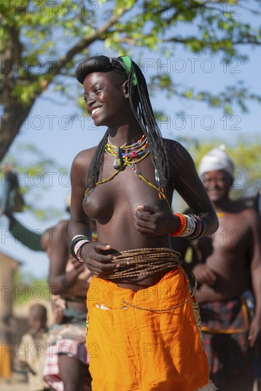 Traditional dance, brightly decorated woman of the Hakaona tribe, also Havakona or Hakawona, near Opuwo, Kunene, Namibia