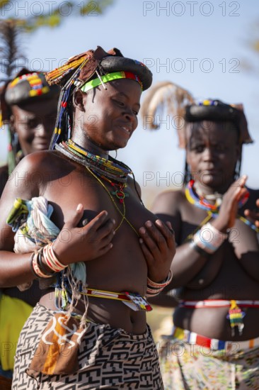Traditional dance, brightly decorated woman of the Hakaona tribe also dance Havakona or Hakawona, near Opuwo, Kunene, Namibia