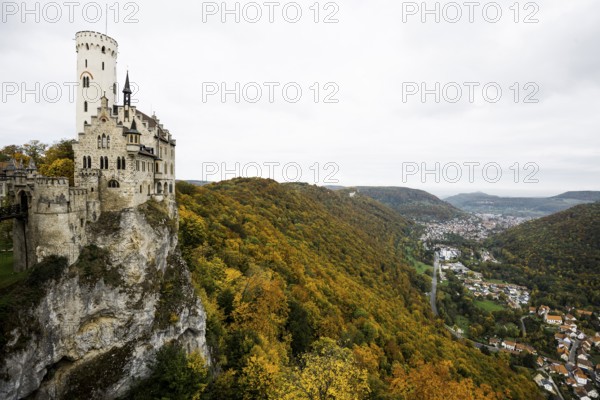 Castle and autumnal forest, Lichtenstein Castle, Honau, Echaz Valley, Swabian Jura, Baden-Württemberg, Germany