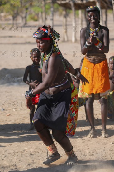 Traditional dance, brightly decorated woman of the Hakaona tribe, also Havakona or Hakawona, near Opuwo, Kunene, Namibia