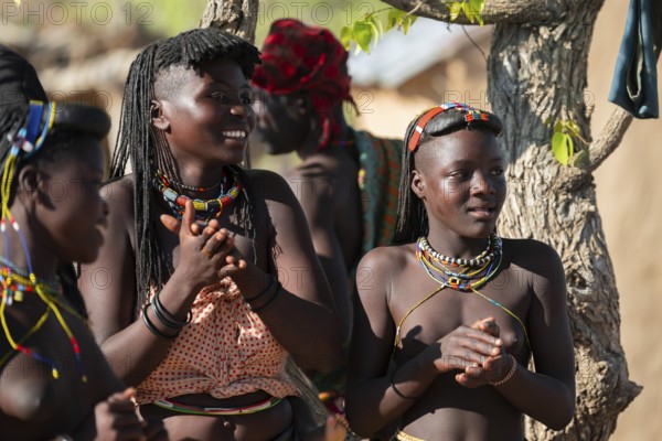 Traditional dance, brightly decorated woman of the Hakaona tribe, also Havakona or Hakawona, near Opuwo, Kunene, Namibia