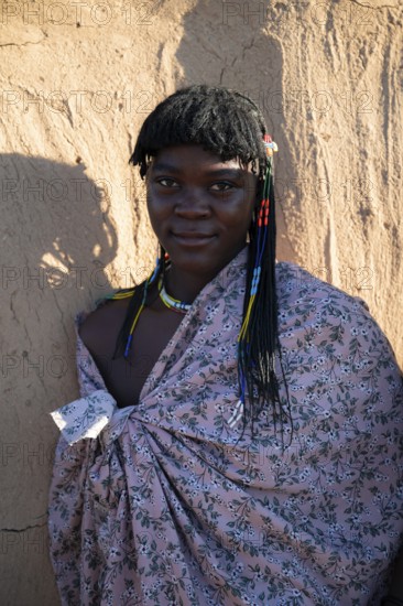 Portrait, brightly decorated woman of the Hakaona tribe, also Havakona or Hakawona, near Opuwo, Kunene, Namibia