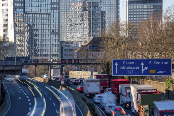 The A40 motorway, Ruhrschnellweg, in Essen, city skyline, Evonik office building, traffic jam in the westbound lane, Duisburg, slow traffic, North Rhine-Westphalia, Germany