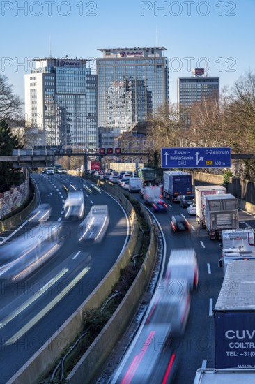 The A40 motorway, Ruhrschnellweg, in Essen, city skyline, Evonik office building, traffic jam in the westbound lane, Duisburg, slow traffic, North Rhine-Westphalia, Germany