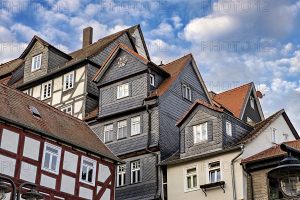 Traditional half-timbered houses with tiled roofs and cloudy skies, The historic city center of Marburg in Hesse