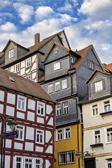 Historic half-timbered houses under a slightly cloudy sky, The historic city center of Marburg in Hesse