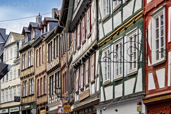 A series of half-timbered houses in various colors that form a lively street scene, The historic old town of Marburg an der Lahn in Hesse