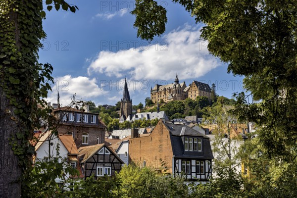 Picturesque view of Marburg's old town with historic half-timbered houses and a castle on a hill, The Landgrave Castle of Marburg in Hesse