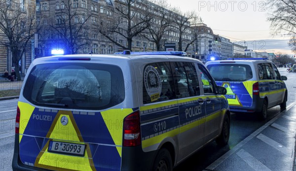 Police vehicles with flashing lights switched on, special operation at the Berlin State Library, Unter den Linden, Berlin, Germany