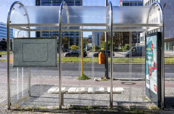 Bus stop with bus shelters and timetable at Ernst Reuter Platz in Berlin-Charlottenburg, Germany