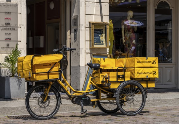 Deutsche Post bicycle loaded with luggage, letter and parcel delivery, Potsdam, Brandenburg, Germany