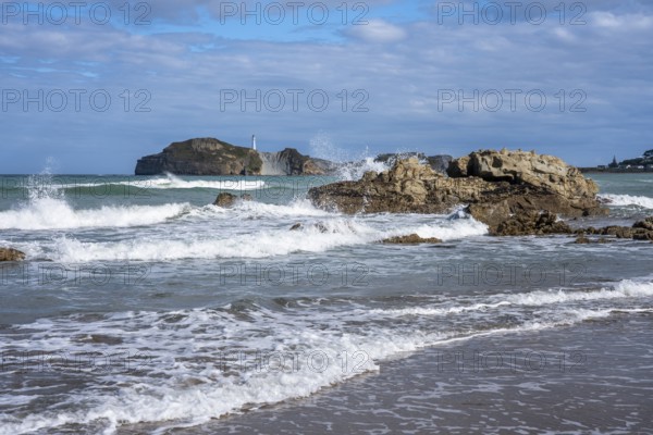 Castlepoint Beach and Castlepoint Lighthouse, ocean, waves, surf, sandy beach, rocks. Castlepoint, Wairarapa Coast, Wellington Region, North Island, New Zealand