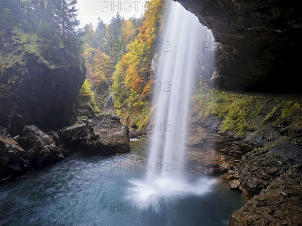 Waterfall mountain list in autumn-colored surroundings, Linthal, Klausenpass, Canton of Glarus, Switzerland