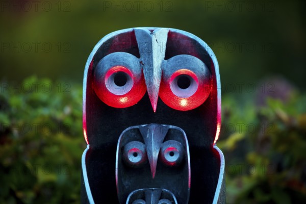 Illumination of an owl-like object during the HerbstlichtGarten event in Sauerlandpark in the evening in Hemer, Sauerland, North Rhine-Westphalia, Germany