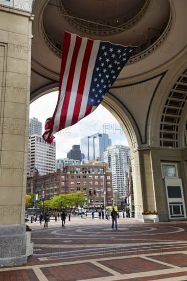 American flag fluttering, distinctive archway, Boston Harbor Hotel, Rowes Wharf, passers-by, Freedom Trail, Financial District, Downtown, Boston, Massachusetts, New England, USA