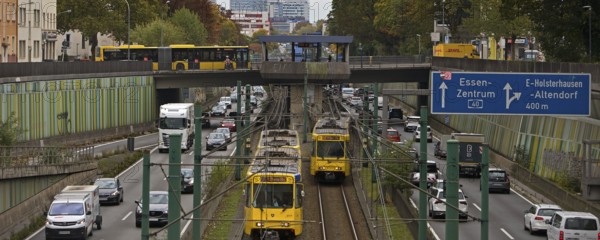 Lots of traffic on the A 40 motorway on four lanes and two subways on two lanes and a bus on the bridge, infrastructure, Essen, Ruhr area, North Rhine-Westphalia, Germany