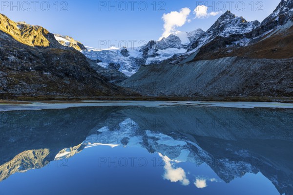 The Moiry glacier and mountain peaks are reflected in Lac de Chateaupre, Val d'Anniviers, Valais Alps, Canton of Valais, Switzerland