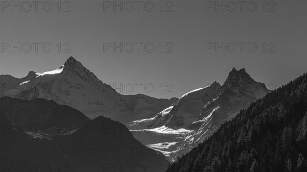 The snow-capped peaks of the Zinalrothorn and Besso mountains, black and white photo, Val d'Anniviers, Valais Alps, Switzerland