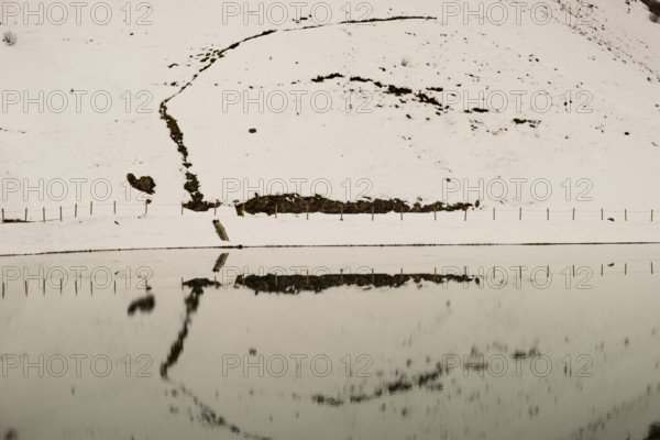 Another onset of winter in May, Riezler Alpsee, an artificially created lake, snow pond, feeds the snow cannons that completely snow the slopes of the Fellhorn and Kanzelwand cable cars, Allgäu Alps, Vorarlberg, Austria
