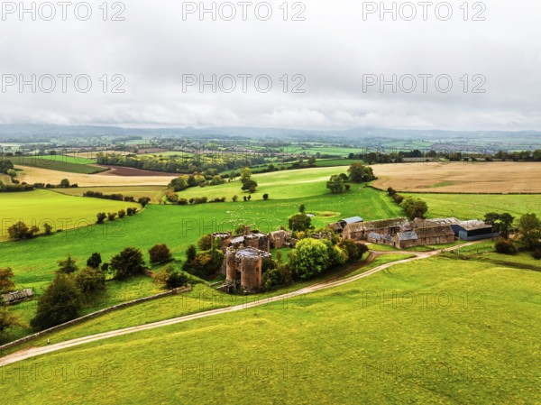 Autumn Colours over ruins of Pembridge Castle or Newland Castle from a drone, Herefordshire, England, United Kingdom