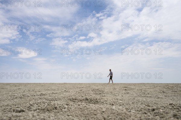 Symbolic picture, abstract, man at the Etosha pan, salt pan, Etosha National Park, Namibia