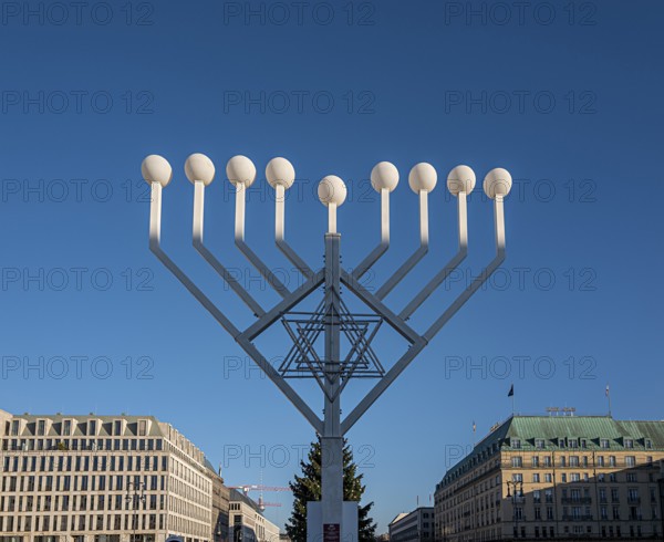 Large Hanukkah chandelier at the Brandenburg Gate in daylight, sign of lively Jewish life, symbolic power for 20 years, Berlin, Germany