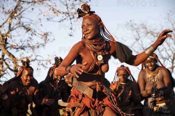 Himba woman dancing euphorically, traditional dance, traditional Himba village, Kaokoveld, Kunene, Namibia